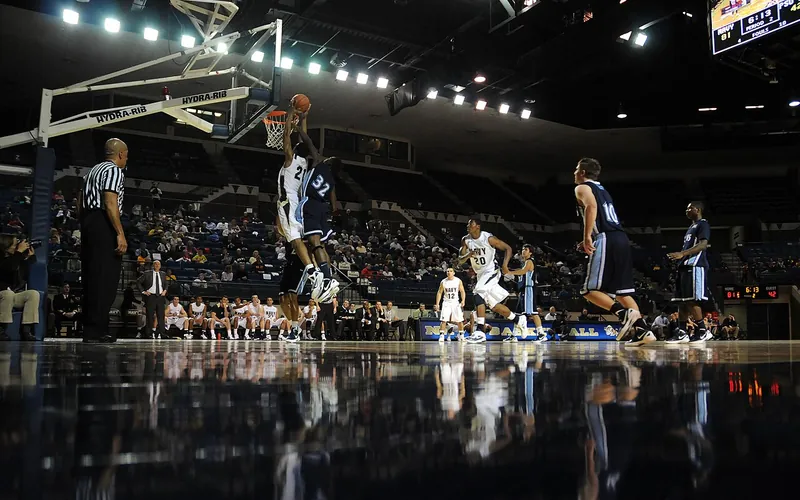 Basketball player dunking during a game