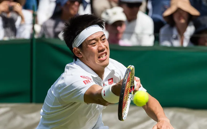 Tennis player serving at Wimbledon